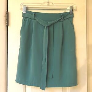 Kikisix mint green elastic waist skirt with pockets and belt tie, size small